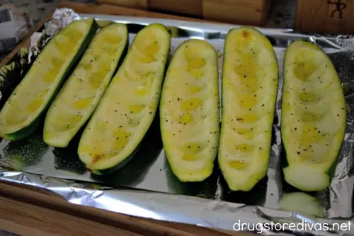 Sausage Stuffed Zucchini Boats are stuffed with sausage, tomatoes, onions, and more. They're good for keto and WW too. 