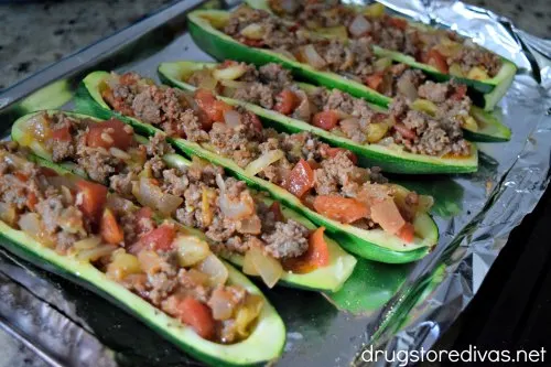 Sausage Stuffed Zucchini Boats are stuffed with sausage, tomatoes, onions, and more. They're good for keto and WW too. 