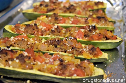 Sausage Stuffed Zucchini Boats are stuffed with sausage, tomatoes, onions, and more. They're good for keto and WW too.