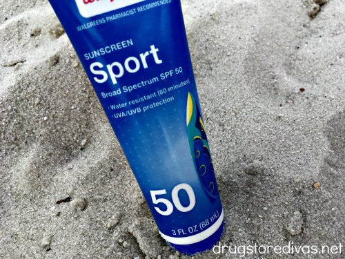 Sunscreen on the sand at a water park.