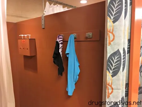 Clothes hanging in a changing room.