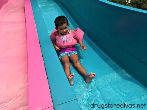 A child going down a waterslide. 