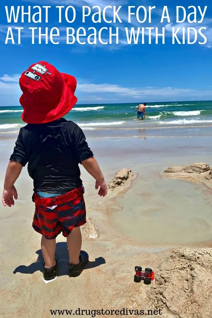 A boy on the beach with the words "What To Pack For A Day At The Beach With Kids" digitally written above him.