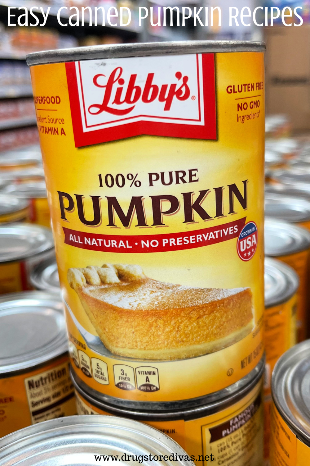 A can of pumpkin on top of other cans of pumpkin with the words 