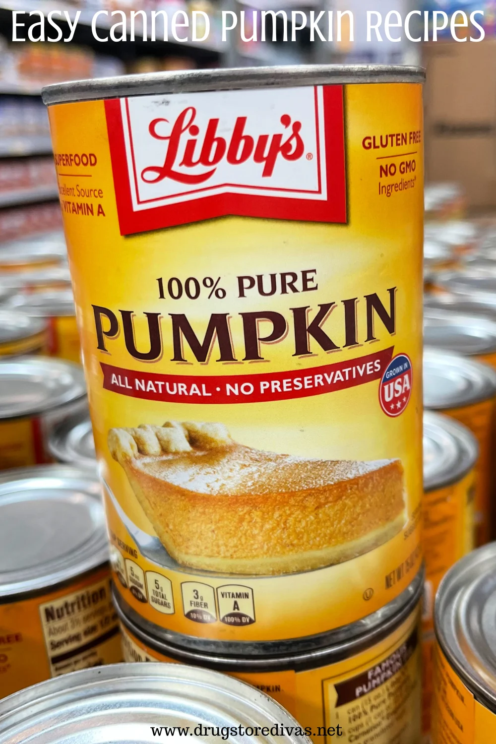 A can of pumpkin on top of other cans of pumpkin with the words 
