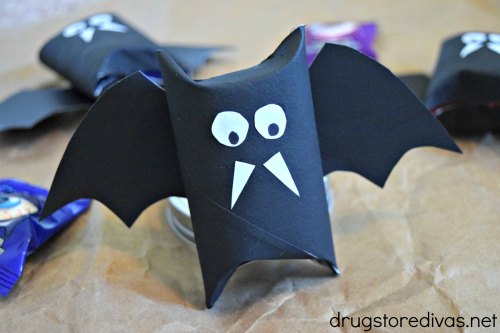 Be the talk of the town when you make these DIY Halloween Bat Candy Tubes for your trick-or-treat bowls. Find out how to make them from upcycled toilet paper rolls on www.drugstoredivas.net.