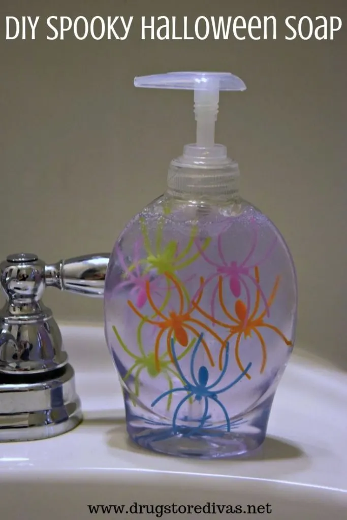 Halloween spider rings in a soap dispenser with the words "DIY Spooky Halloween Soap" digitally on top.
