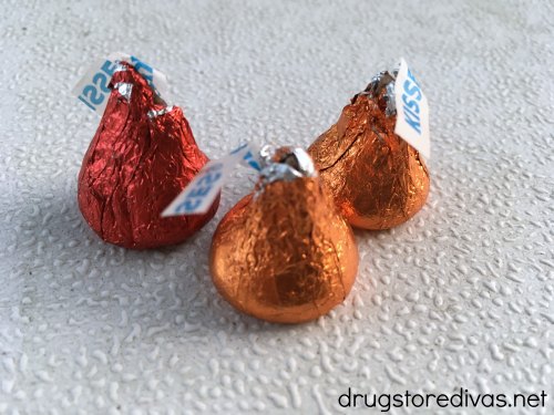 Three Hershey's Kisses on a table.