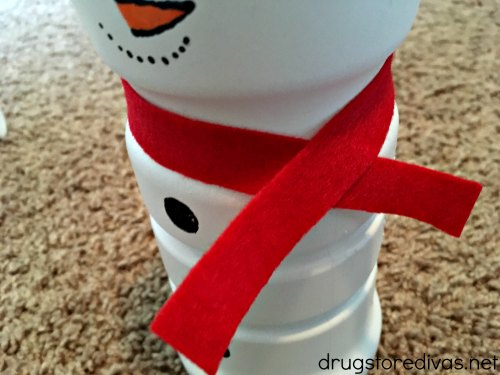Felt tied around a painted snowman's neck.