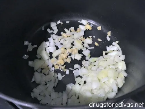 Garlic and onions in a pot.