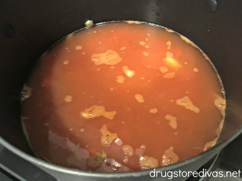 Red broth in a pot.