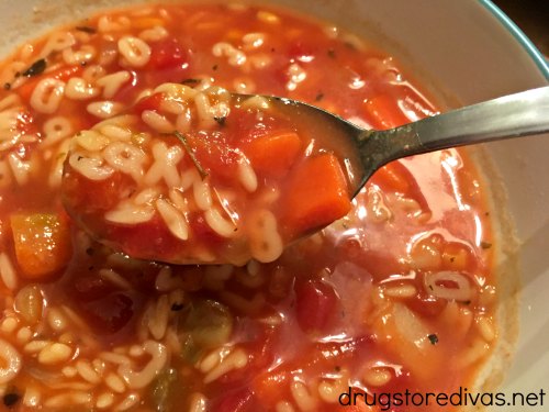 Alphabet soup on a spoon and in a bowl.