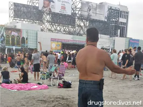 Stage on the beach with people watching.