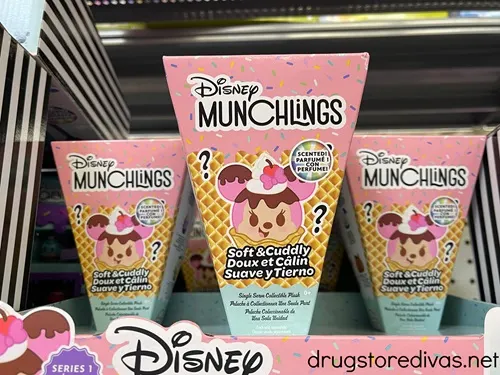 Three boxes of Disney Munchlings toys on a shelf.