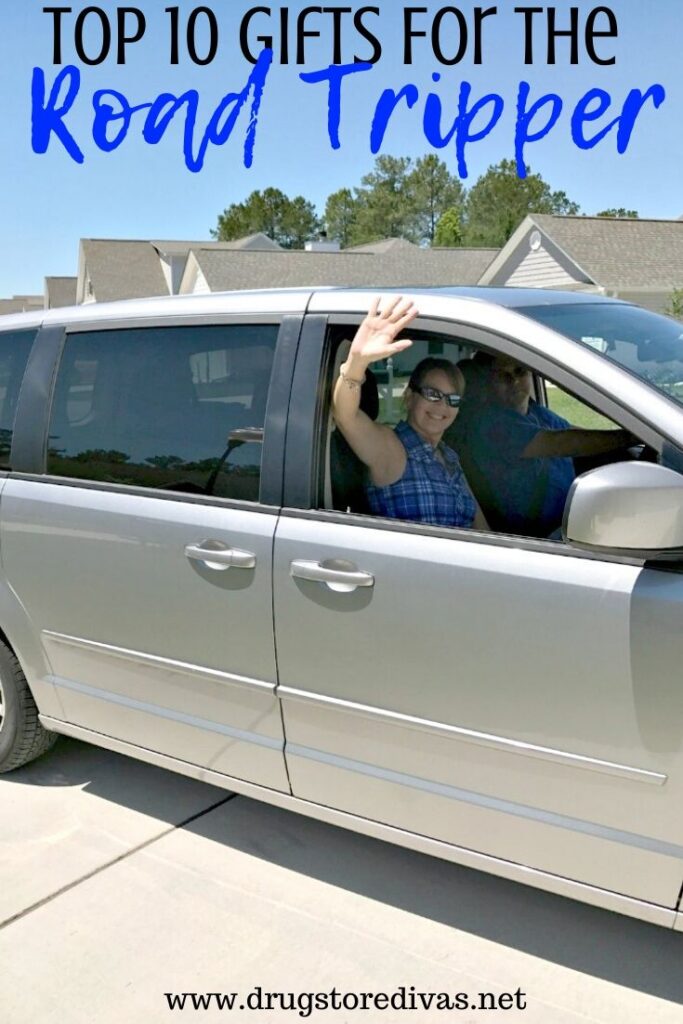 A woman waving from the passenger side of a van and the words "Top 10 Gifts For The Road Tripper" digitally written above her.