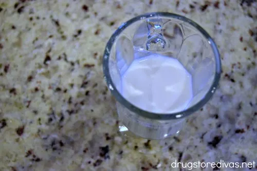 A Irish soda glass with milk in it.