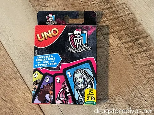 An Uno card game, with images of Monster High characters on the cards.