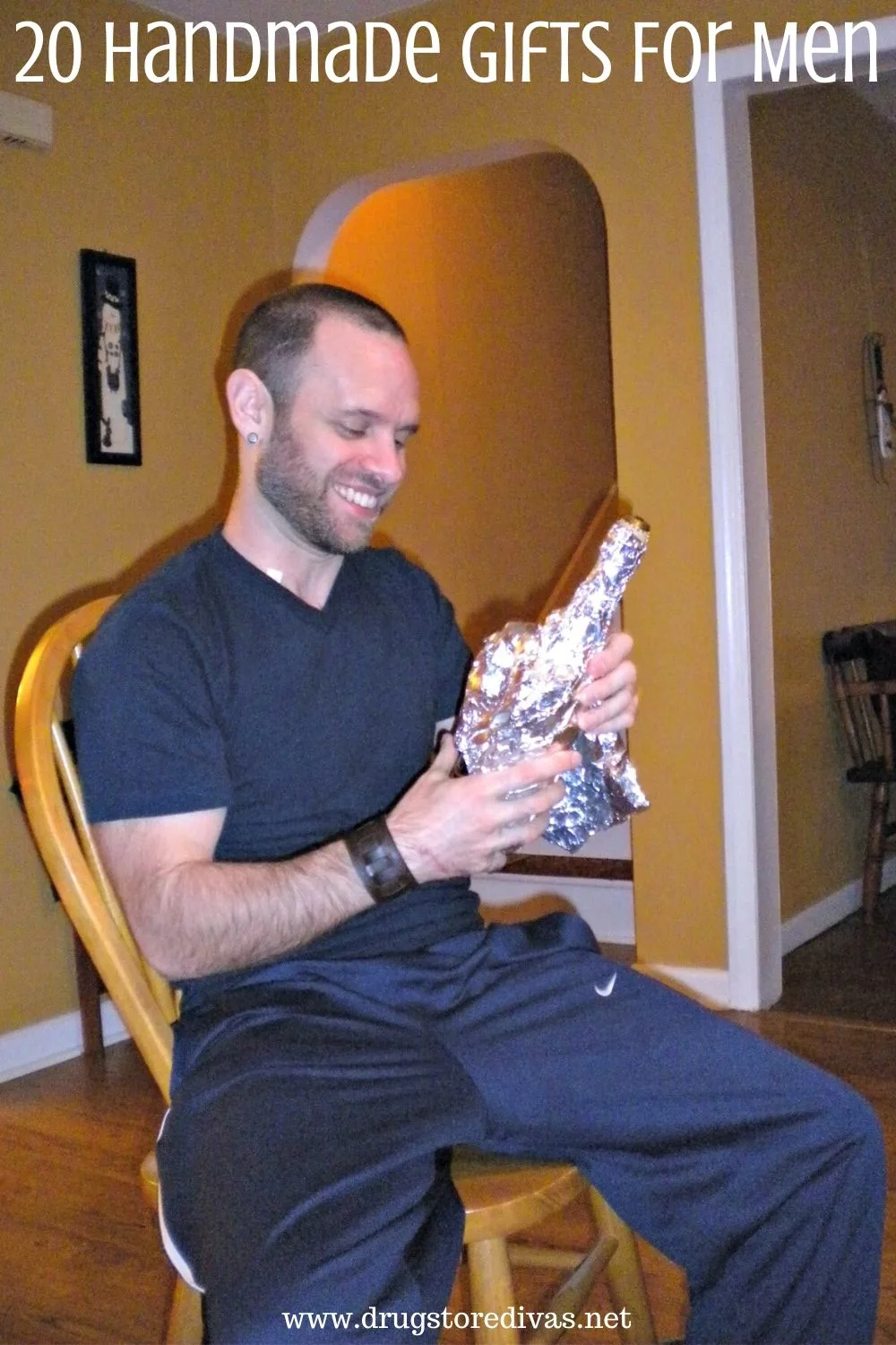 Man holding a gift wrapped in foil with the words "20 Handmade Gifts For Men" digitally written on top.