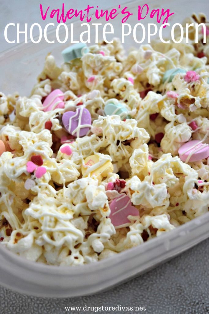 Popcorn covered with white chocolate, sprinkles, and conversation hearts with the words "Valentine's Day Chocolate Popcorn" digitally written on top.