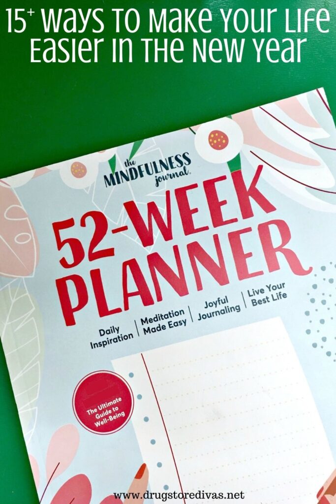 A 52-week planner with the words "15+ Ways To Make Your Life Easier In The New Year" digitally written on top.
