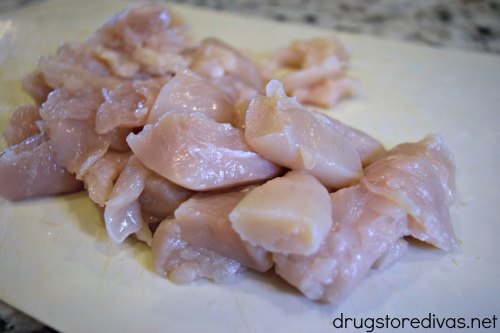 Pieces of uncooked chicken breast.