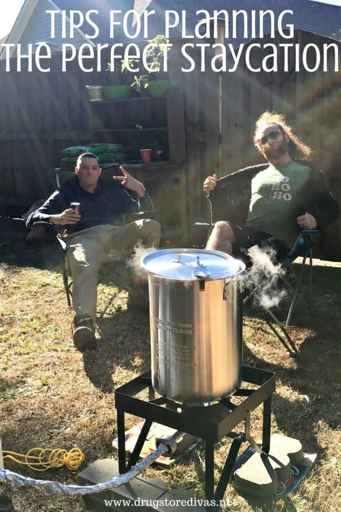 Two men sitting outside near a large deep frying pot with the words "Tips For Planning The Perfect Staycation" digitally written on top.