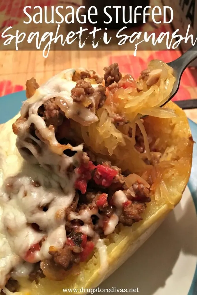 Spaghetti squash stuffed with sausage, onion, tomato, and cheese, on a plate, with the words "Sausage Stuffed Spaghetti Squash" digitally written on top.