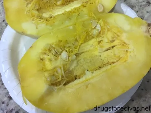 Sausage Stuffed Spaghetti Squash will be your new favorite low carb dinner. Get the recipe, and find out how to easily cut spaghetti squash, on www.drugstoredivas.net.