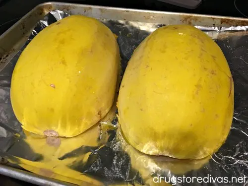 Sausage Stuffed Spaghetti Squash will be your new favorite low carb dinner. Get the recipe, and find out how to easily cut spaghetti squash, on www.drugstoredivas.net.