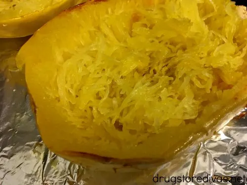 Sausage Stuffed Spaghetti Squash will be your new favorite low carb dinner. Get the recipe, and find out how to easily cut spaghetti squash, on www.drugstoredivas.net.