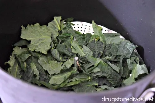 Kale in a steamer basket.
