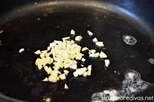 Garlic cooking in a pan.