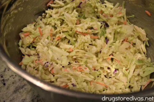 This Bacon And Bleu Coleslaw is the easiest potluck side dish. Get the recipe at www.drugstoredivas.net.