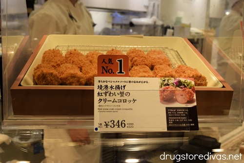 A tray filled with crab croquettes for sale in a store in Japan.