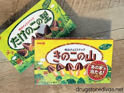 A box of Meiji mushroom-shaped chocolates on top of a box of bamboo shoot-shaped chocolates.