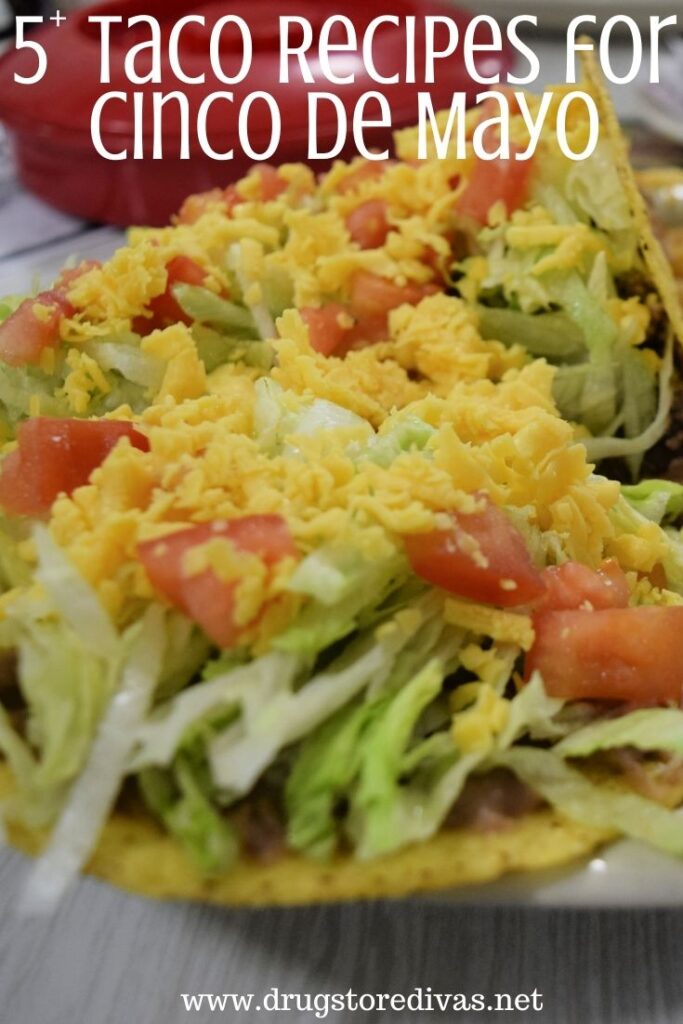 A plate of tacos with lettuce, tomato, and cheese on top and the words "5+ Taco Recipes For Cinco De Mayo" digitally written on top.