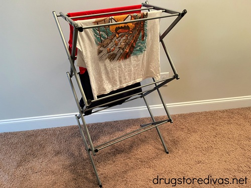 Clothes hanging on a drying rack.