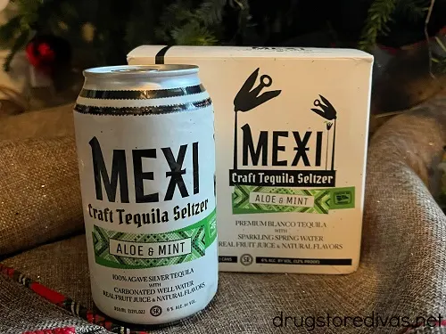 A can of Mexi Seltzer in front of a box of the same product.