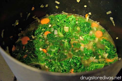 This Kale & Bean Soup will be your new favorite soup. It's super healthy, accidentally vegan, and can be zero points on Weight Watchers. Get the recipe at www.drugstoredivas.net.