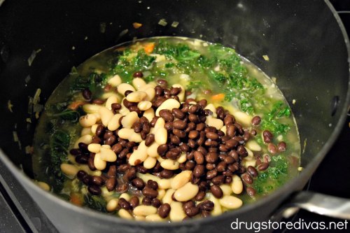 This Kale & Bean Soup will be your new favorite soup. It's super healthy, accidentally vegan, and can be zero points on Weight Watchers. Get the recipe at www.drugstoredivas.net.