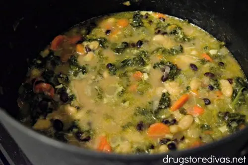 Kale & Bean Soup in a pot on the stove.