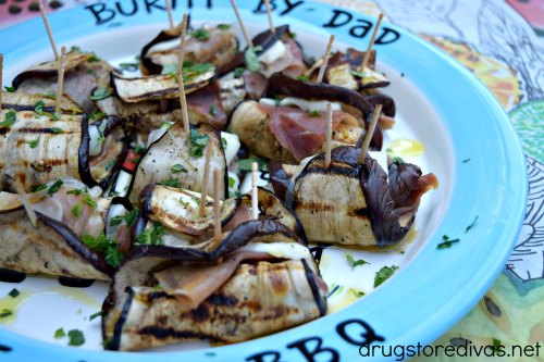 Grilled Eggplant, Prosciutto & Mozzarella Roll Ups on a plate.