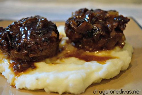 Mini Meatloaf Smothered In Bacon Jam will be your new favorite dinner. It'll be a hit with non-meatloaf lovers too. Get the recipe at www.drugstoredivas.net.