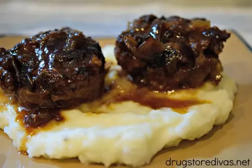 Mini Meatloaf Smothered In Bacon Jam will be your new favorite dinner. It'll be a hit with non-meatloaf lovers too. Get the recipe at www.drugstoredivas.net.