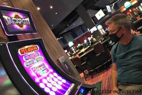 A man gambling at a slot machine in Harrah's Murphy North Carolina.