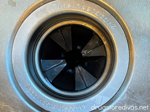 A view of the garbage disposal in the sink from above.