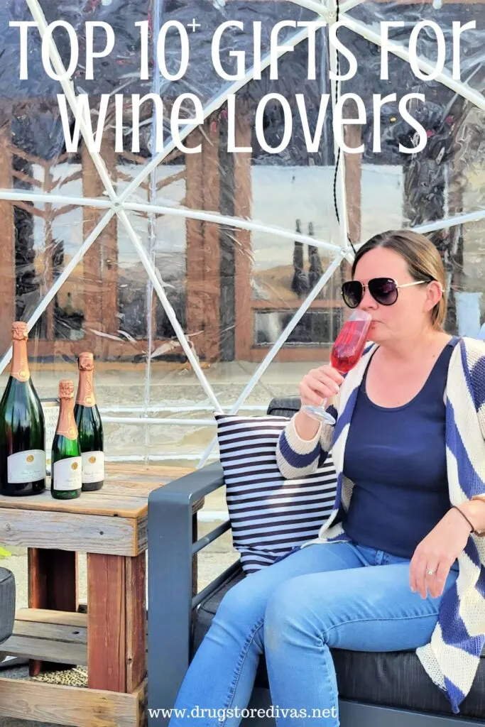 A woman sipping a drink next to three wine bottles with the words "Top 10+ Gifts For Wine Lovers" digitally written above her.