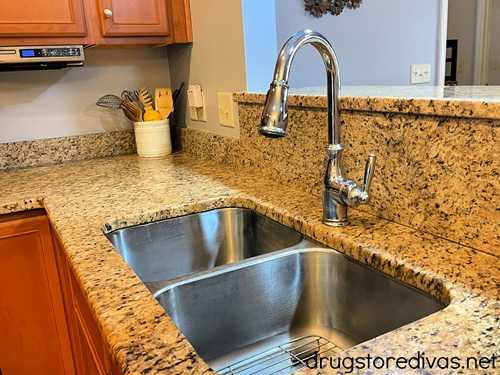 A kitchen sink in a house.