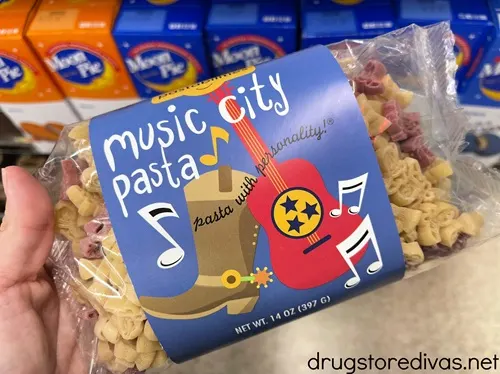 A hand holding a bag of Music City Pasta.