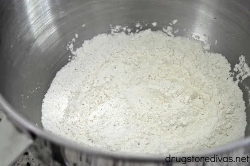 Flour in a silver mixing bowl.